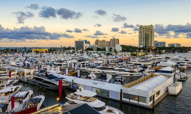 Yachts at FLIBS with twilight sky in background