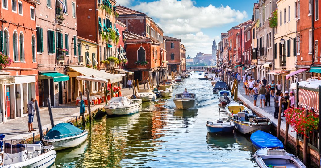 the famous canals of Venice where luxury charter yachts are not allowed to cruise but provides a romantic setting while guests are enjoying their vacation 