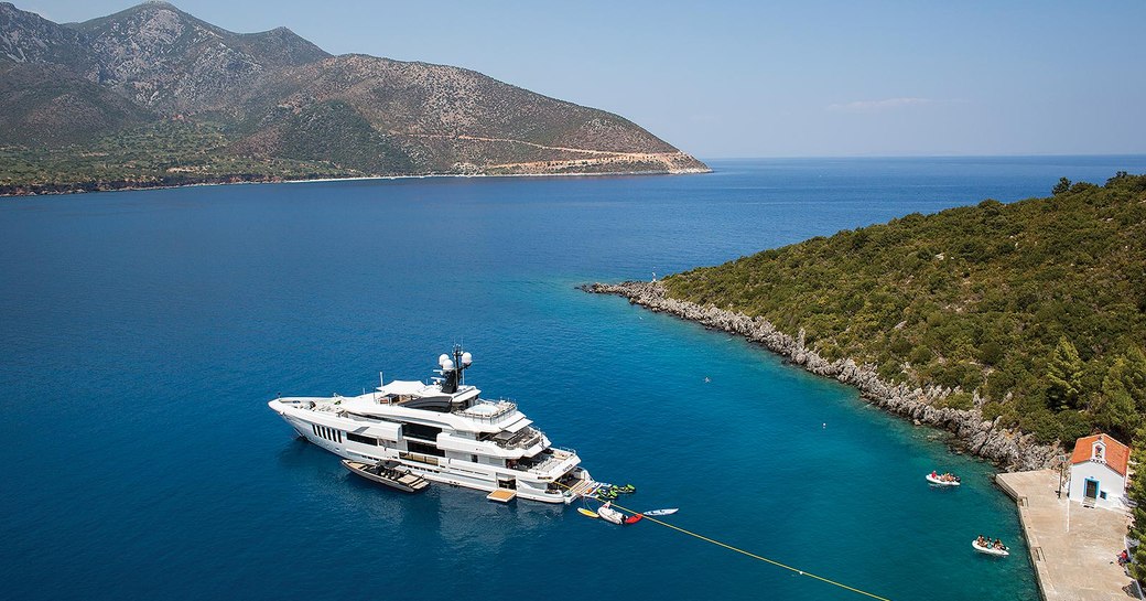 Charter yacht at anchor in a quiet cove in greece