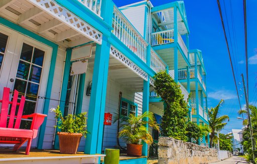 Colorful Caribbean Architecture, Caribbean house exterior with tropical plants and street. Elbow Cay, Hope Town, Abaco,
