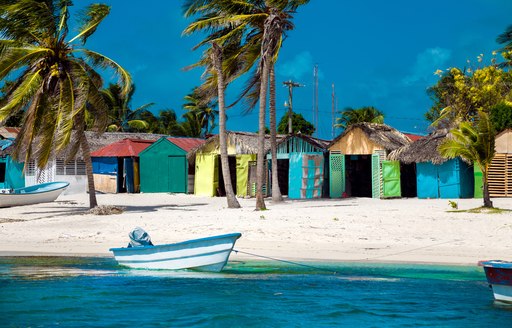 Colorful houses line a Caribbean beach