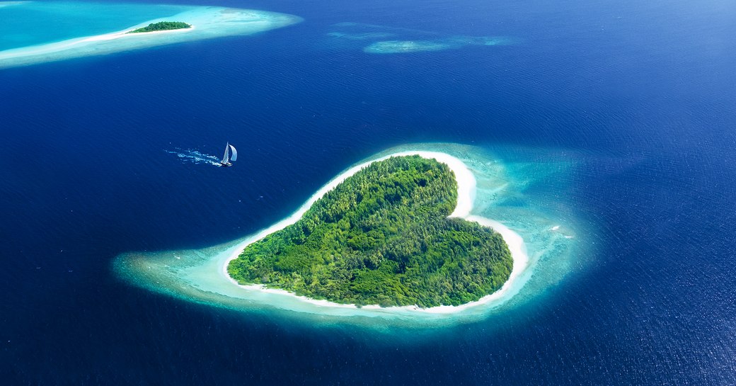aerial shot of heart-shaped addu atoll in the maldives