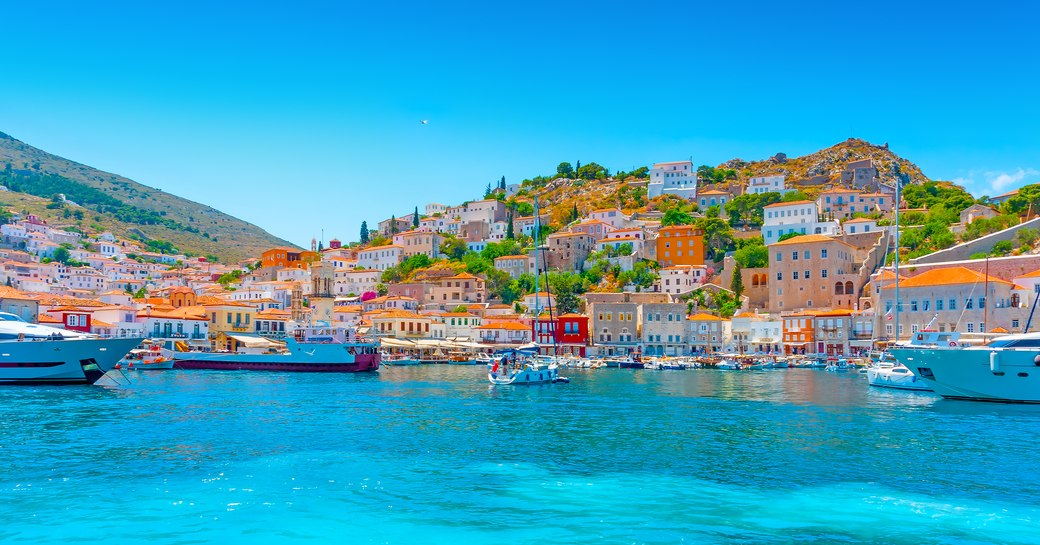 Crystal blue shores of old main port in Hydra, Greece