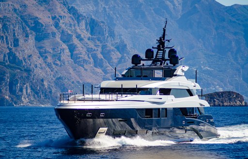 Blue superyacht cruising along Italian Coast 