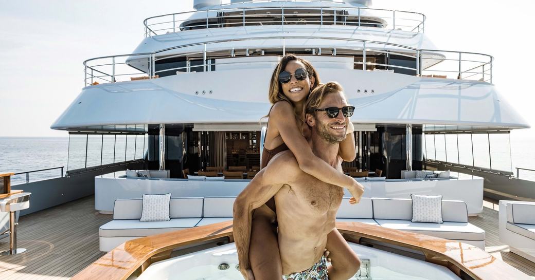 couple on aft deck on mykonos yacht