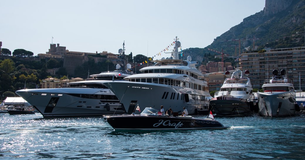 Motor yachts lined up in Port Hercules marina in Monaco