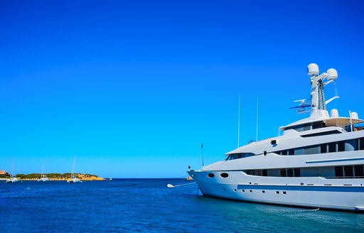 Motor yacht anchored in the azure waters in Sardinia