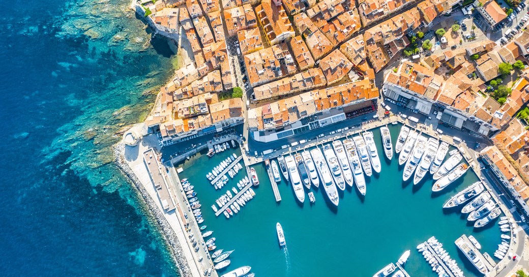 Aerial view of charter yachts moored in port