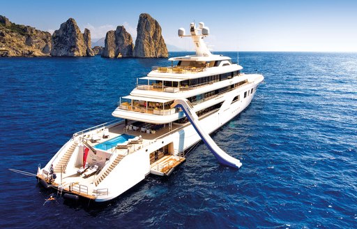 superyacht aquarius on her charter season through the Mediterranean with all of her water toys and, swim platform, and beach club on display