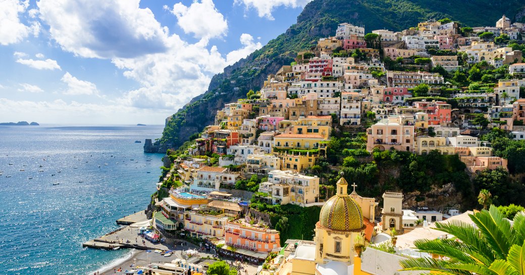 the candy coloured buildinsg of the hot charter yacht destination positano